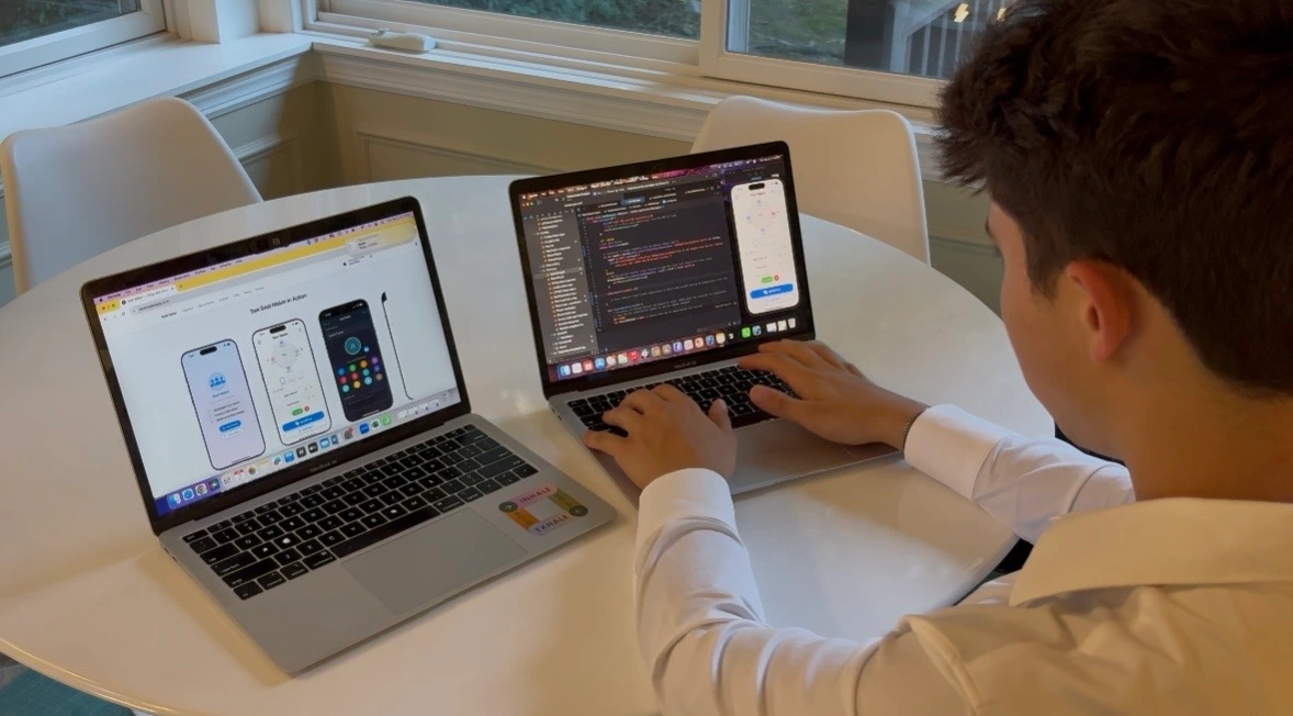 Austin Frankel coding at his desk